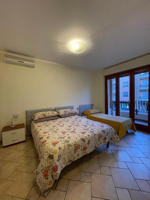 Postel nebo postele na pokoji v ubytování Studio Sole e Residenza Luna Assisi