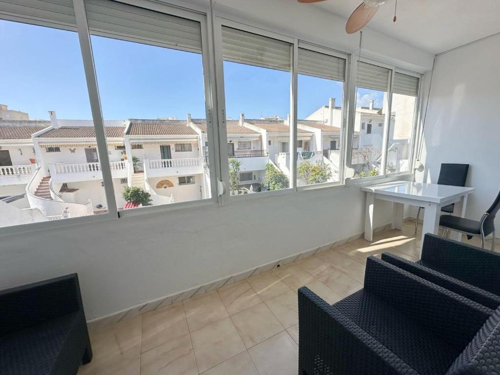 TV a/nebo společenská místnost v ubytování AH RENTALS Acualandia Apartamento