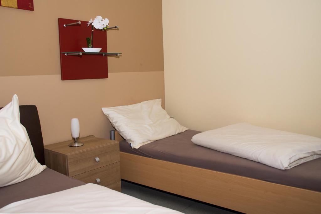 Postel nebo postele na pokoji v ubytování Welog Rast Ilz