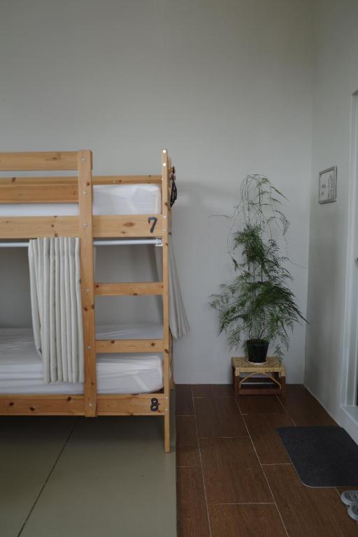 Postel nebo postele na pokoji v ubytování Ji Zi Inn