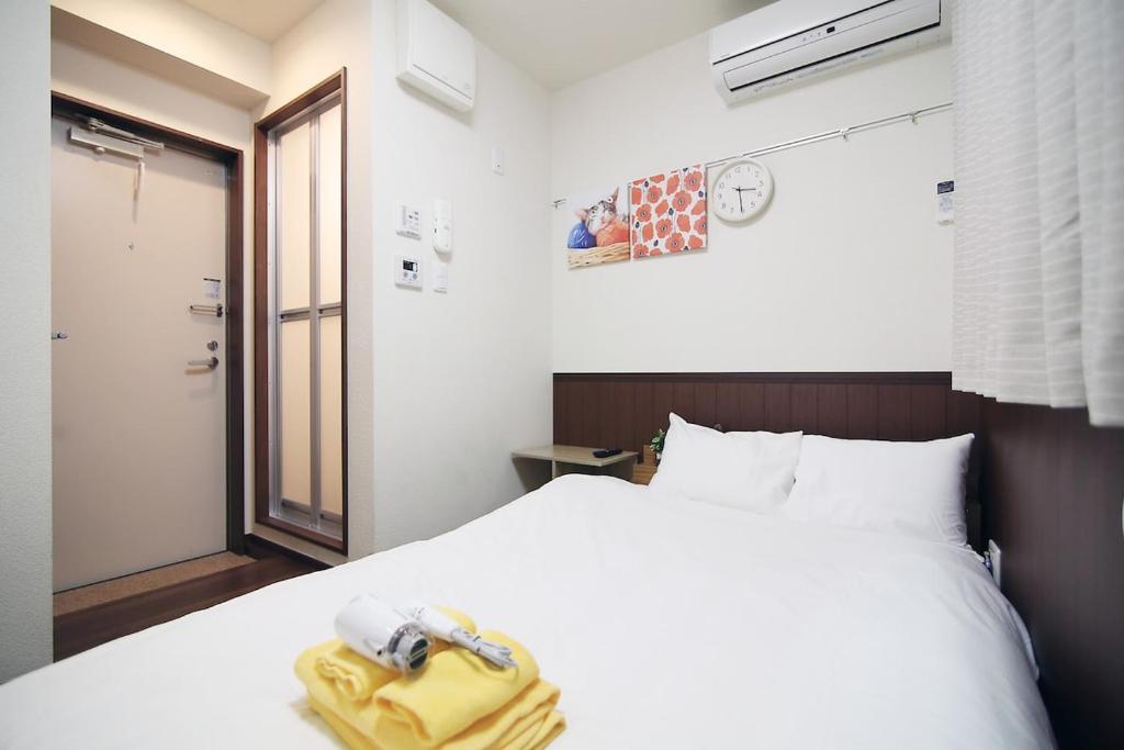 Ένα ή περισσότερα κρεβάτια σε δωμάτιο στο Central Shinjuku, Near Train Station, Quiet Area, No Stairs, Room 102
