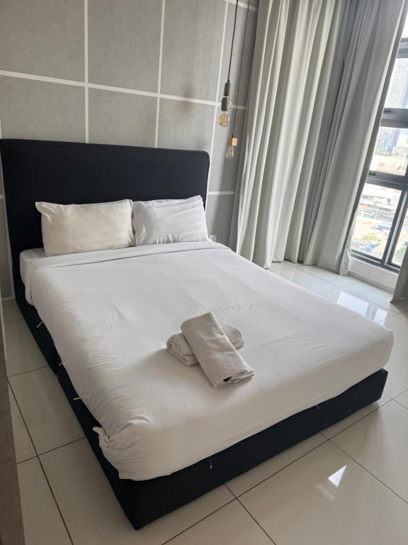 Ένα ή περισσότερα κρεβάτια σε δωμάτιο στο Robertson suites At Bukit Bintang South Lobby