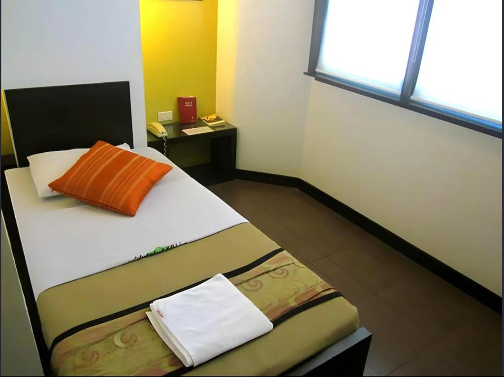 Postel nebo postele na pokoji v ubytování Hotel Mikka
