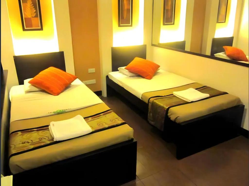 Postel nebo postele na pokoji v ubytování Hotel Mikka