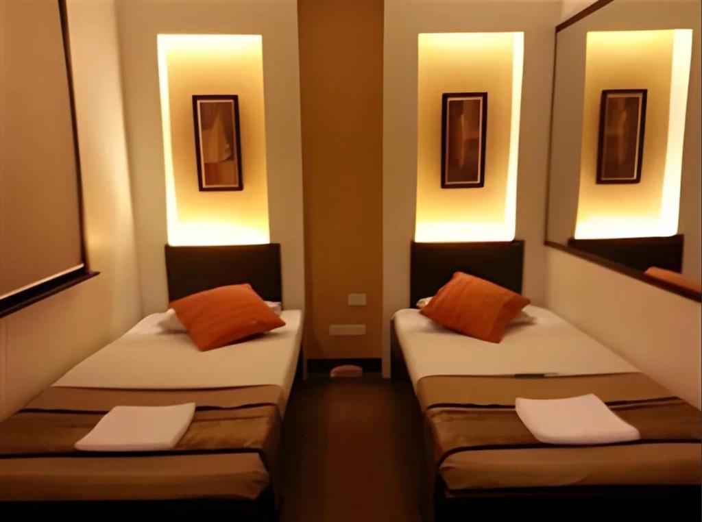 Postel nebo postele na pokoji v ubytování Hotel Mikka
