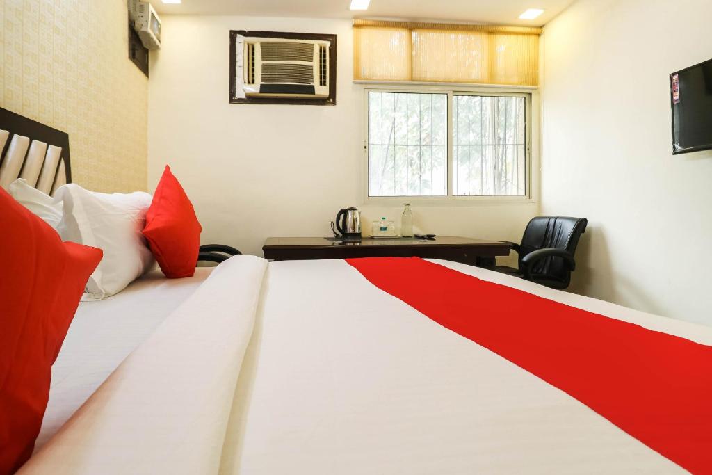 Postel nebo postele na pokoji v ubytování Hotel O Sagar Stay Inn