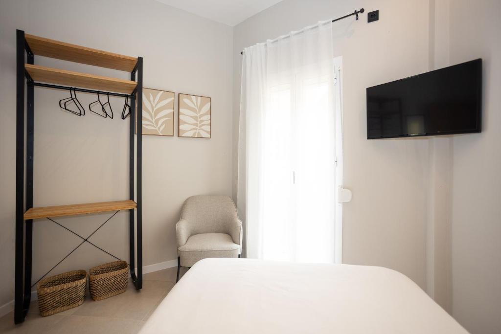 Posteľ alebo postele v izbe v ubytovaní Chinitas Urban Rooms