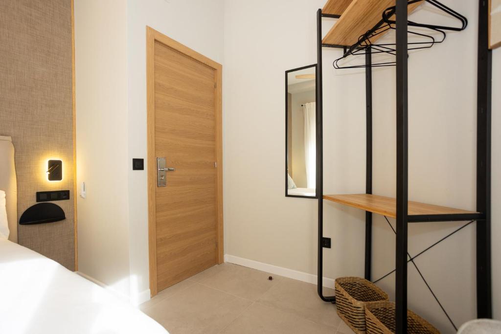 Posteľ alebo postele v izbe v ubytovaní Chinitas Urban Rooms