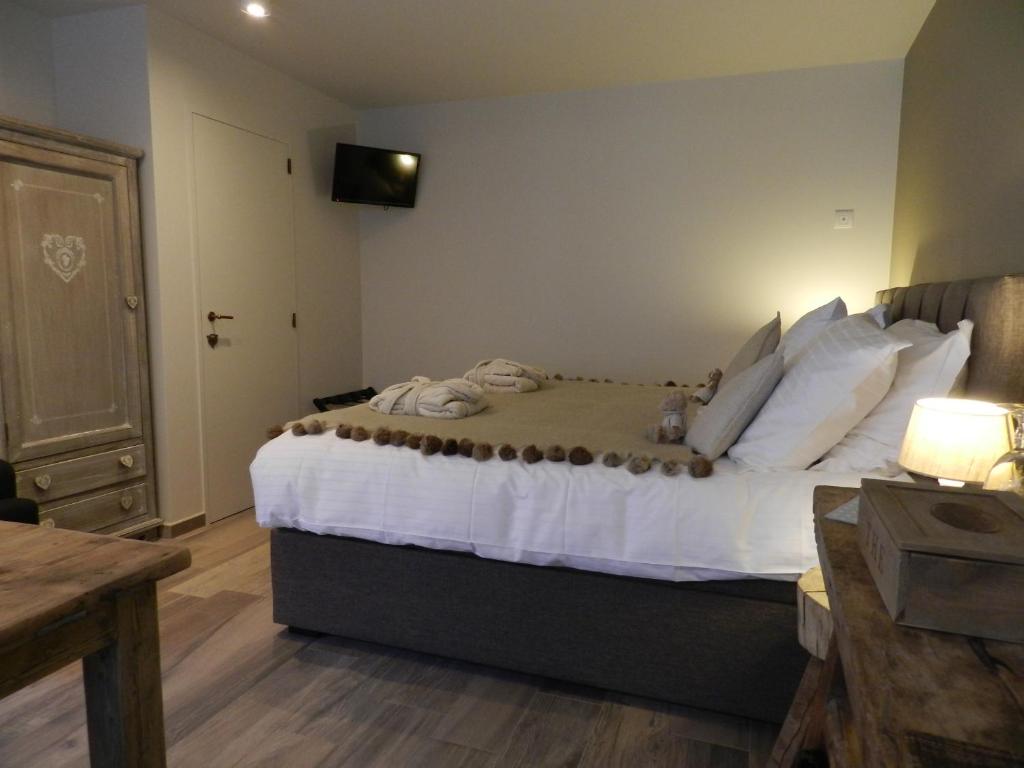 Postel nebo postele na pokoji v ubytování B&B De Swaenhoeck