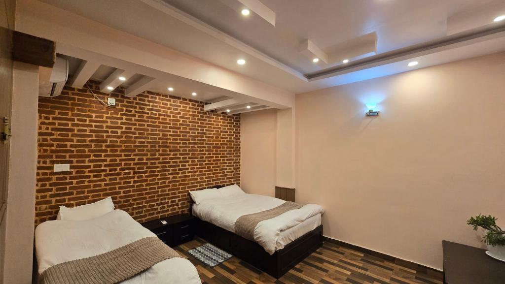 Postel nebo postele na pokoji v ubytování Cosmo Homes