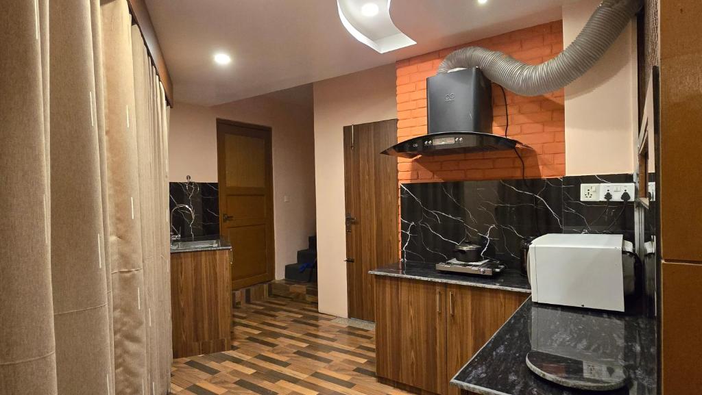 Kuchyň nebo kuchyňský kout v ubytování Cosmo Homes