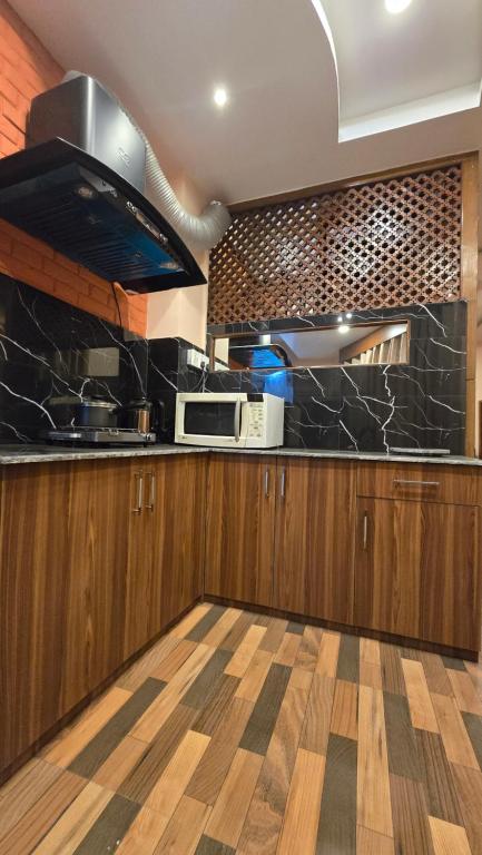 Kuchyň nebo kuchyňský kout v ubytování Cosmo Homes