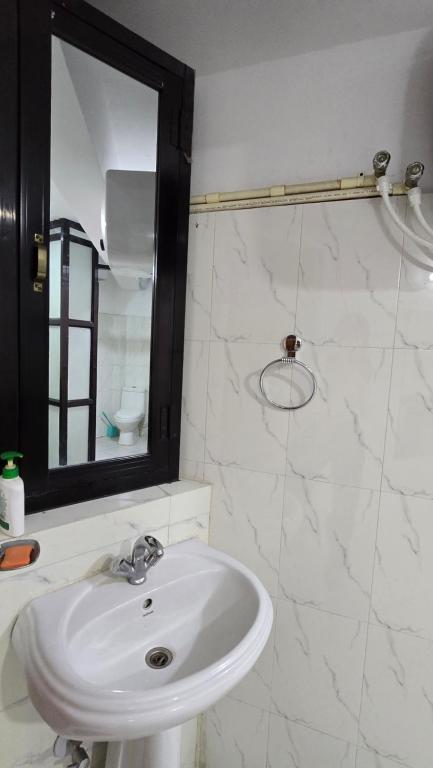 Koupelna v ubytování Cosmo Homes