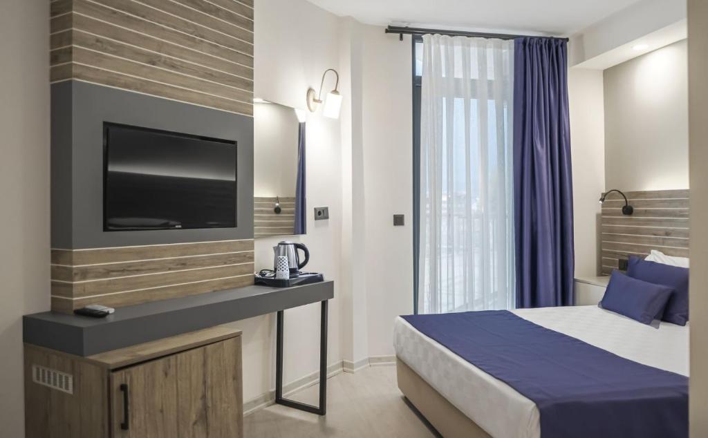 Postel nebo postele na pokoji v ubytování Side Square Hotel