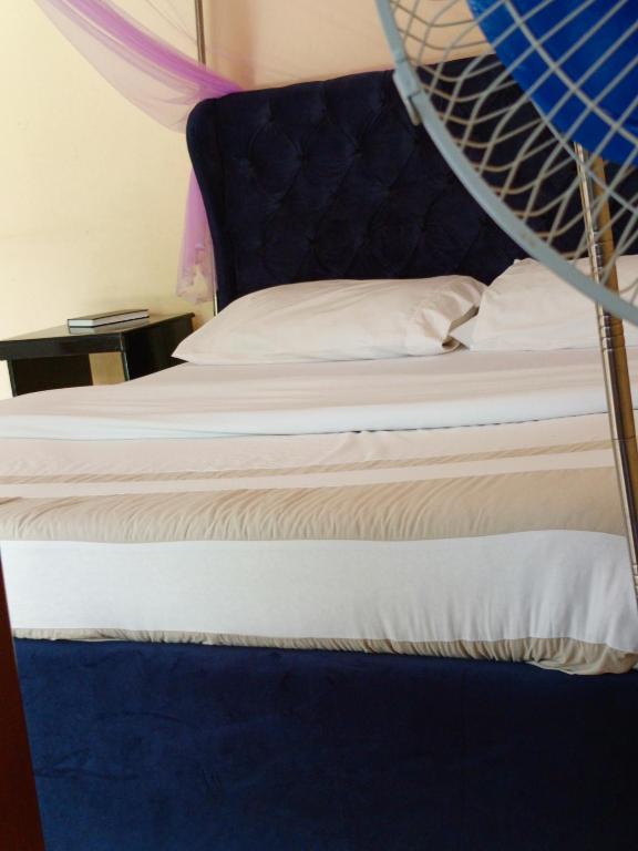 Postel nebo postele na pokoji v ubytování Pross Residence