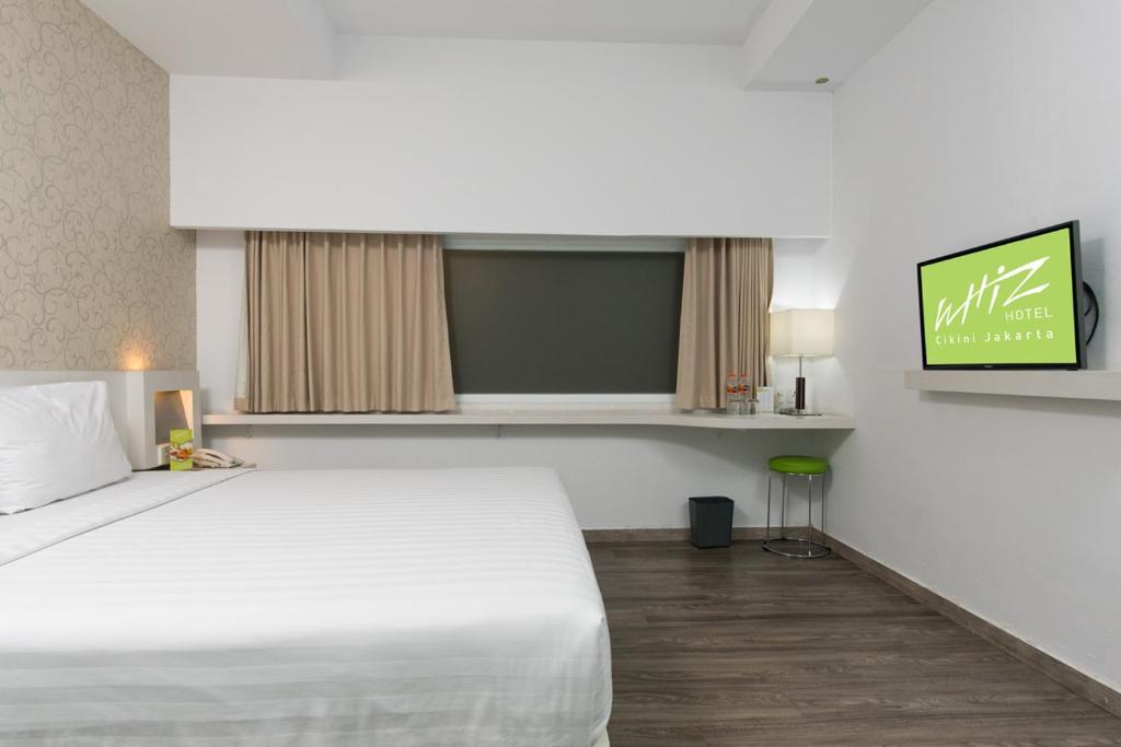 Postel nebo postele na pokoji v ubytování Whiz Hotel Cikini Jakarta