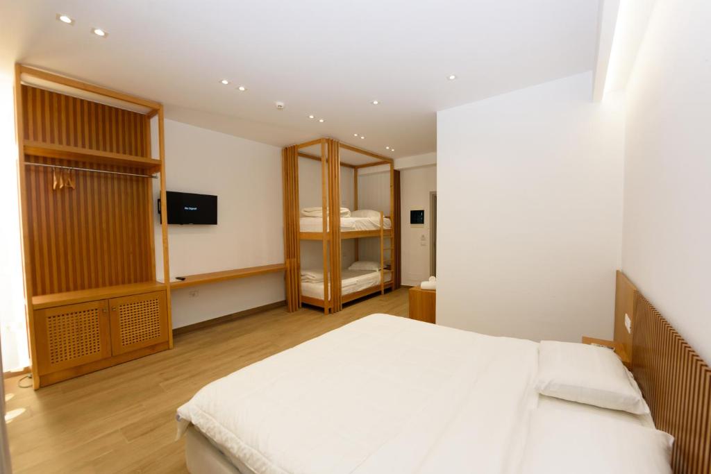 Postel nebo postele na pokoji v ubytování Hotel Nimfa