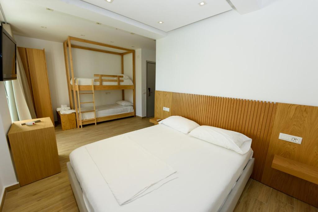 Postel nebo postele na pokoji v ubytování Hotel Nimfa