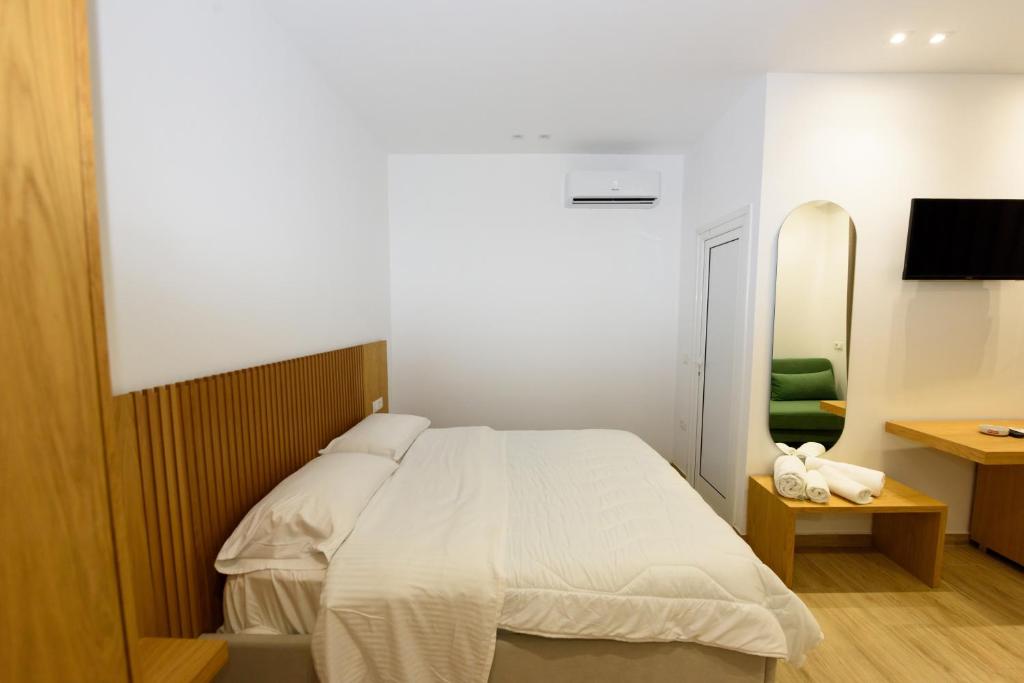 Postel nebo postele na pokoji v ubytování Hotel Nimfa