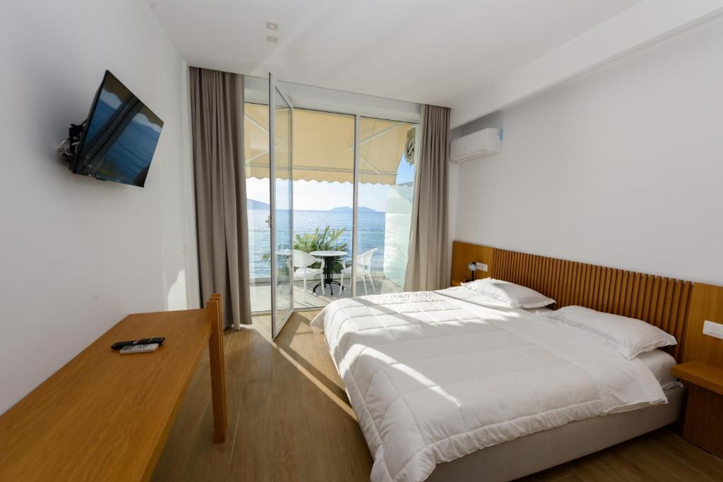 Postel nebo postele na pokoji v ubytování Hotel Nimfa