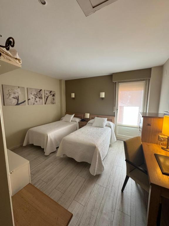 Postel nebo postele na pokoji v ubytování Hotel Alda A Boira