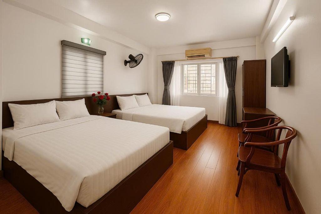 Postel nebo postele na pokoji v ubytování Noi Bai Sunflower Hotel