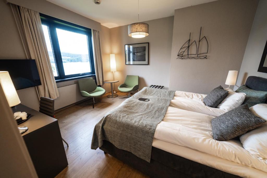 Postel nebo postele na pokoji v ubytování Hurdalsjøen Hotel & Spa