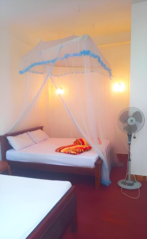 Postel nebo postele na pokoji v ubytování Senehas Homestay