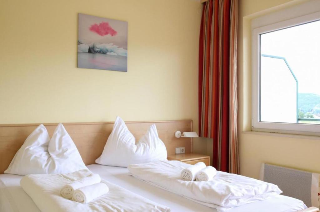 Postel nebo postele na pokoji v ubytování Apartmenthotel Karawankenblick