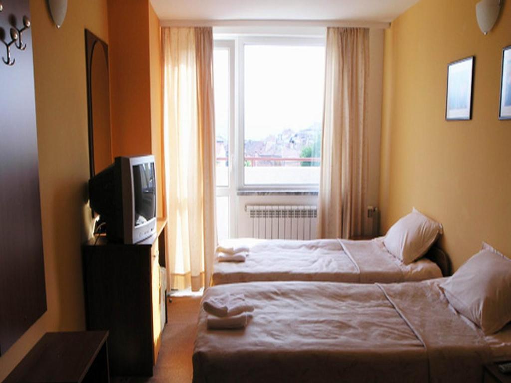 Postel nebo postele na pokoji v ubytování Hotel Ertancom