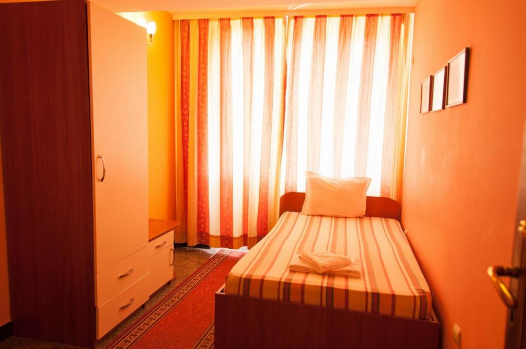 Postel nebo postele na pokoji v ubytování Hotel Ertancom