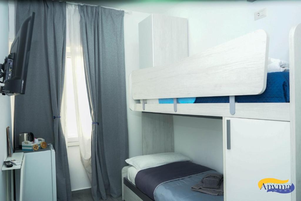 Postel nebo postele na pokoji v ubytování Anyma Home