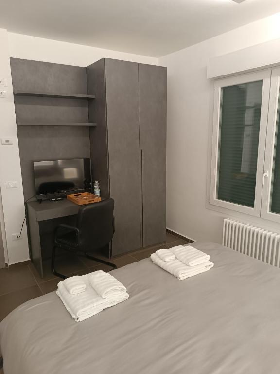 Postel nebo postele na pokoji v ubytování CIVICO 14 Holiday Rooms