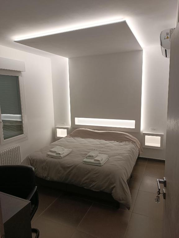 Postel nebo postele na pokoji v ubytování CIVICO 14 Holiday Rooms