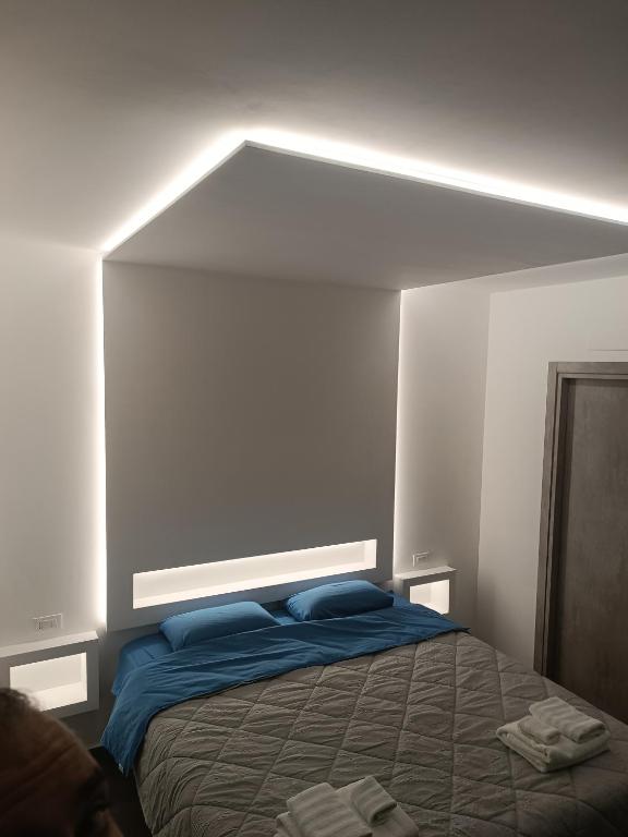 Postel nebo postele na pokoji v ubytování CIVICO 14 Holiday Rooms