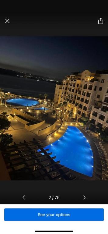 a picture of a swimming pool in a hotel at Samarah Resort Apartment D32 at DeadSea, Sea & Pool view- Families & couples only in Sowayma