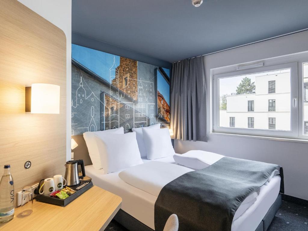 Postel nebo postele na pokoji v ubytování B&B Hotel Schweinfurt-City