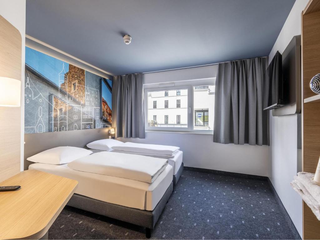Postel nebo postele na pokoji v ubytování B&B Hotel Schweinfurt-City