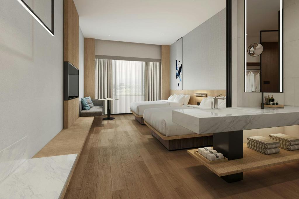 Postel nebo postele na pokoji v ubytování Fairfield by Marriott Quanzhou Fengze