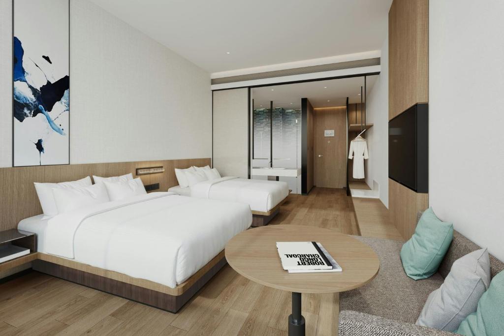 Postel nebo postele na pokoji v ubytování Fairfield by Marriott Quanzhou Fengze