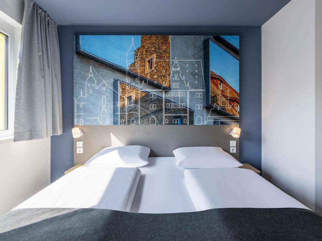 Postel nebo postele na pokoji v ubytování B&B Hotel Schweinfurt-City