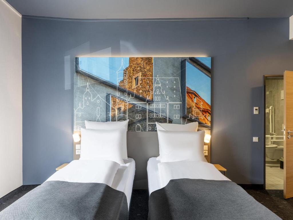 Postel nebo postele na pokoji v ubytování B&B Hotel Schweinfurt-City