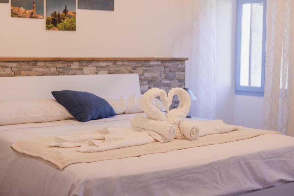 Postel nebo postele na pokoji v ubytování Emozione del lago