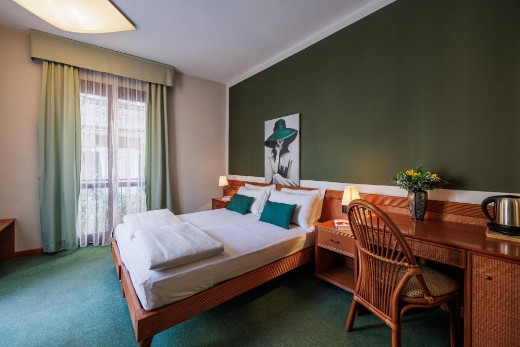 Postel nebo postele na pokoji v ubytování Hotel alla Grotta
