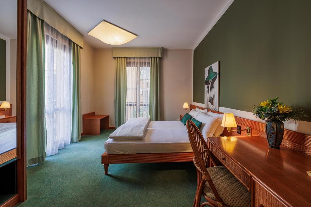 Postel nebo postele na pokoji v ubytování Hotel alla Grotta