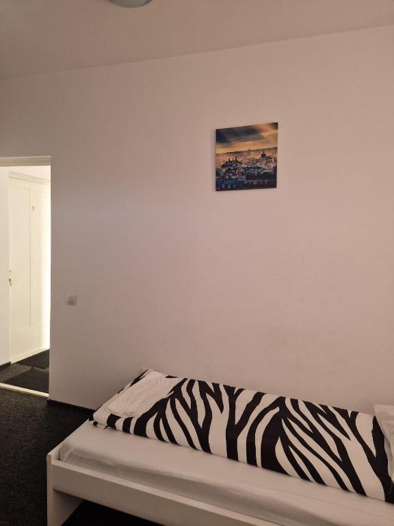 Postel nebo postele na pokoji v ubytování BigCitty Rooms