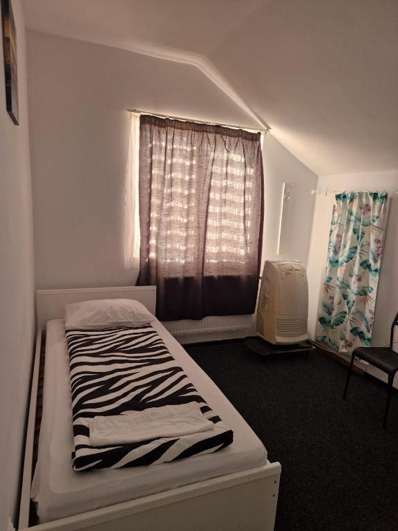 Postel nebo postele na pokoji v ubytování BigCitty Rooms