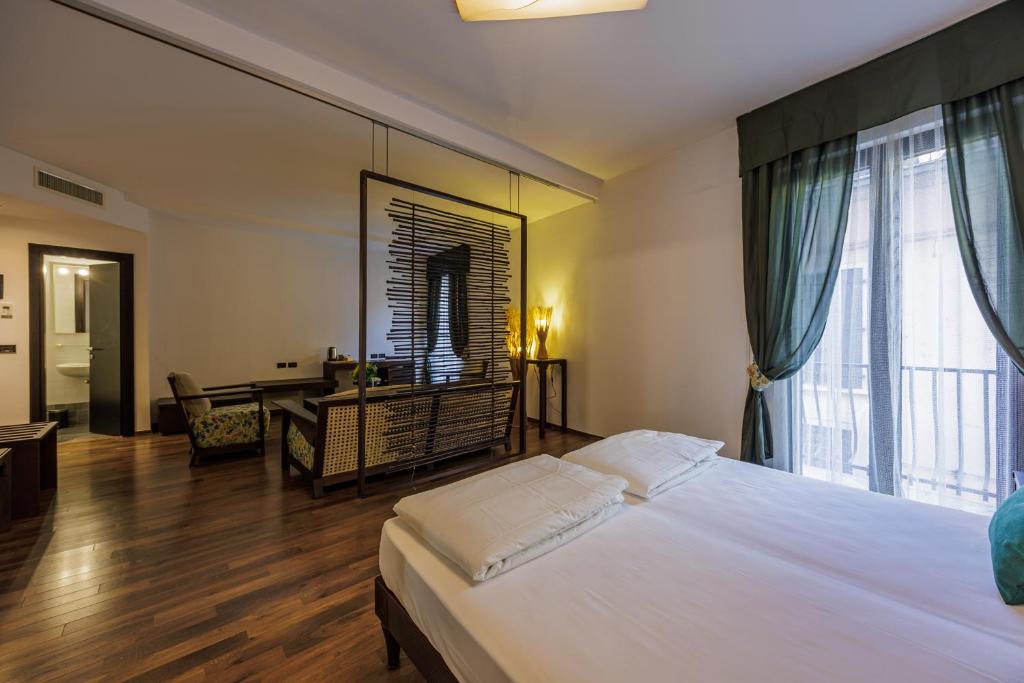 Postel nebo postele na pokoji v ubytování Hotel alla Grotta
