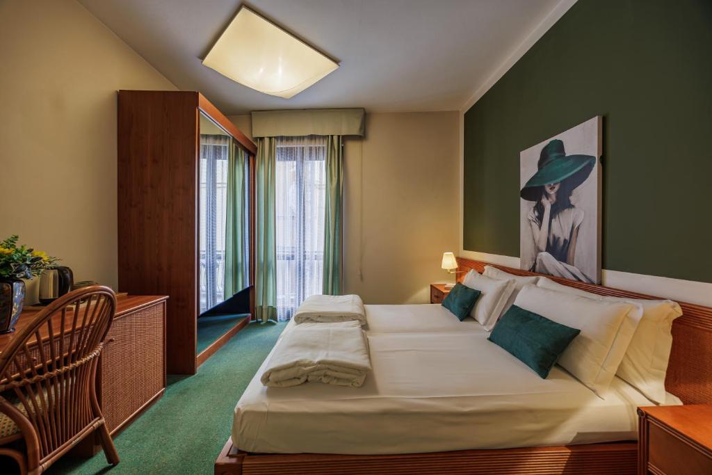 Postel nebo postele na pokoji v ubytování Hotel alla Grotta