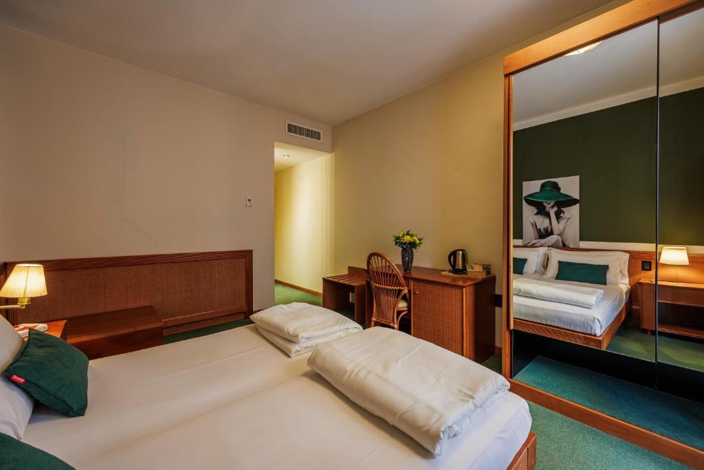 Postel nebo postele na pokoji v ubytování Hotel alla Grotta